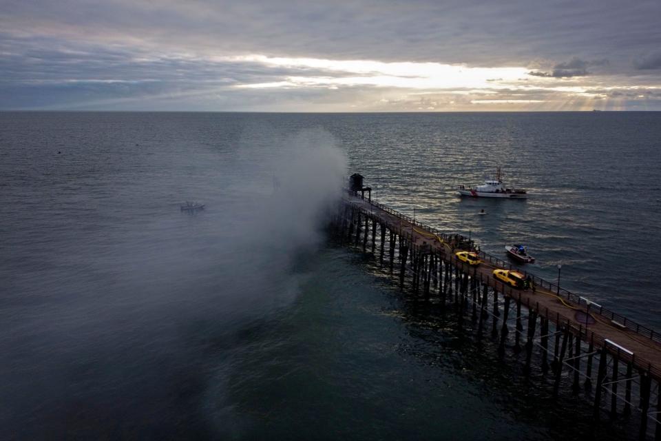 A fire burns Thursday on the West end of the Oceanside Pier, in Oceanside, California.