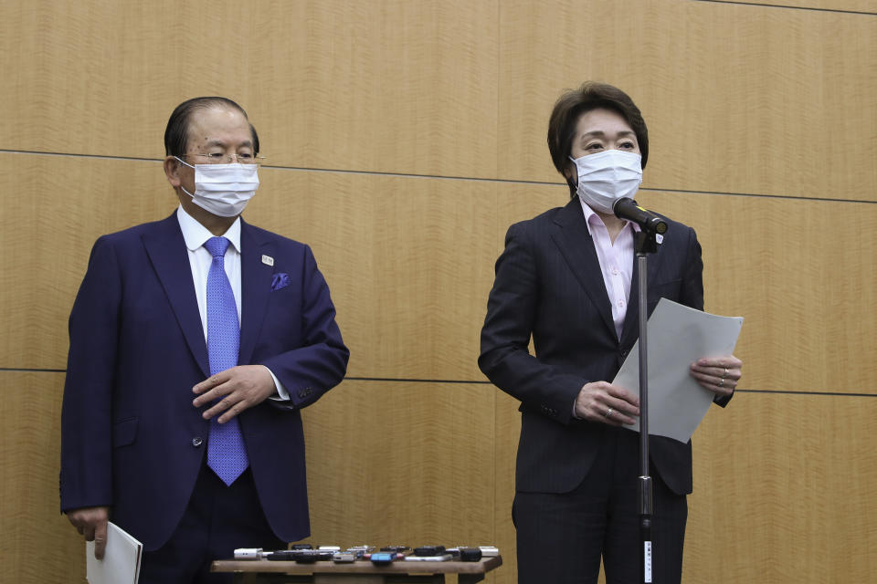 Seiko Hashimoto, right, president of the Tokyo Organizing Committee of the Olympic and Paralympic Games (Tokyo 2020), speaks as Toshiro Muto, CEO of Tokyo 2020, stands by her after a five-party meeting at the Tokyo 2020 headquarters in Tokyo on Wednesday, March 3, 2021. (Du Xiaoyi/Pool Photo via AP)