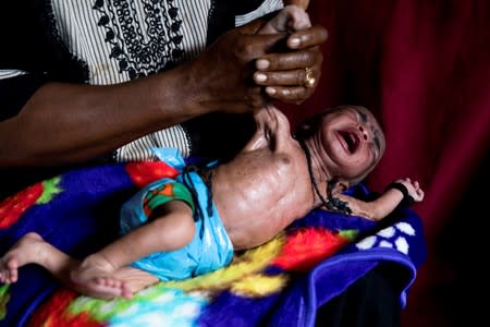 The Wider Image: Tanzania's Zanzibar begins to register traditional healers