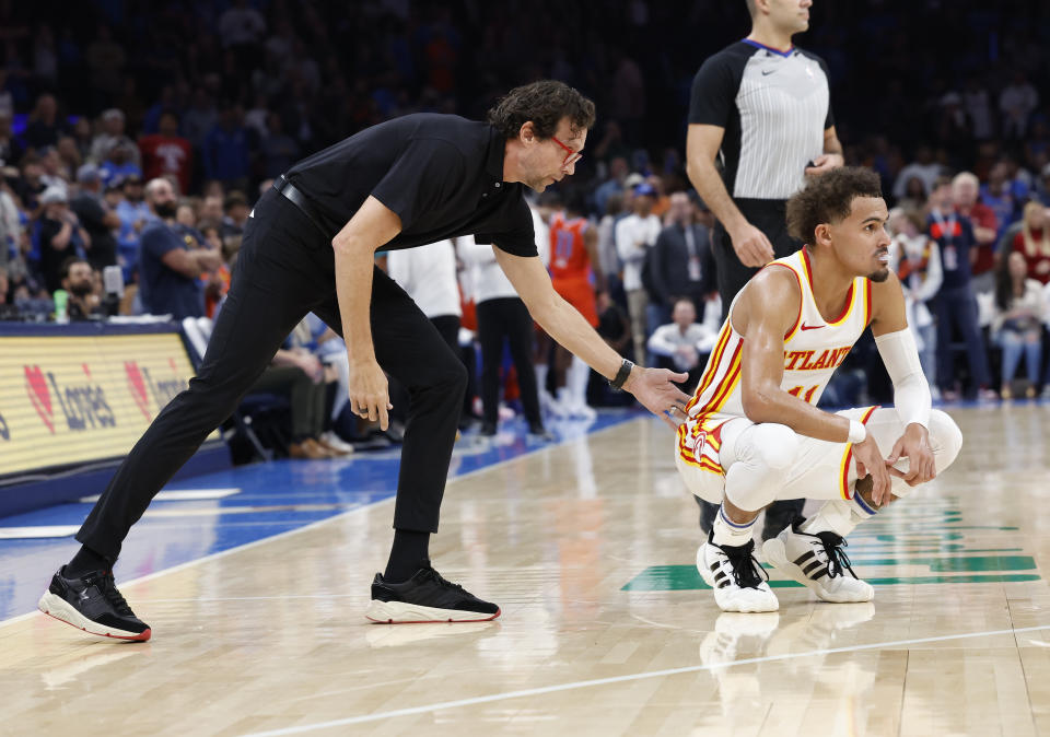 Nov 6, 2023; Oklahoma City, Oklahoma, USA; Atlanta Hawks head coach Quin Snyder gestures to Atlanta Hawks guard Trae Young (11) during the second half against the Oklahoma City Thunder at Paycom Center. Oklahoma City won 126-117. Mandatory Credit: Alonzo Adams-USA TODAY Sports