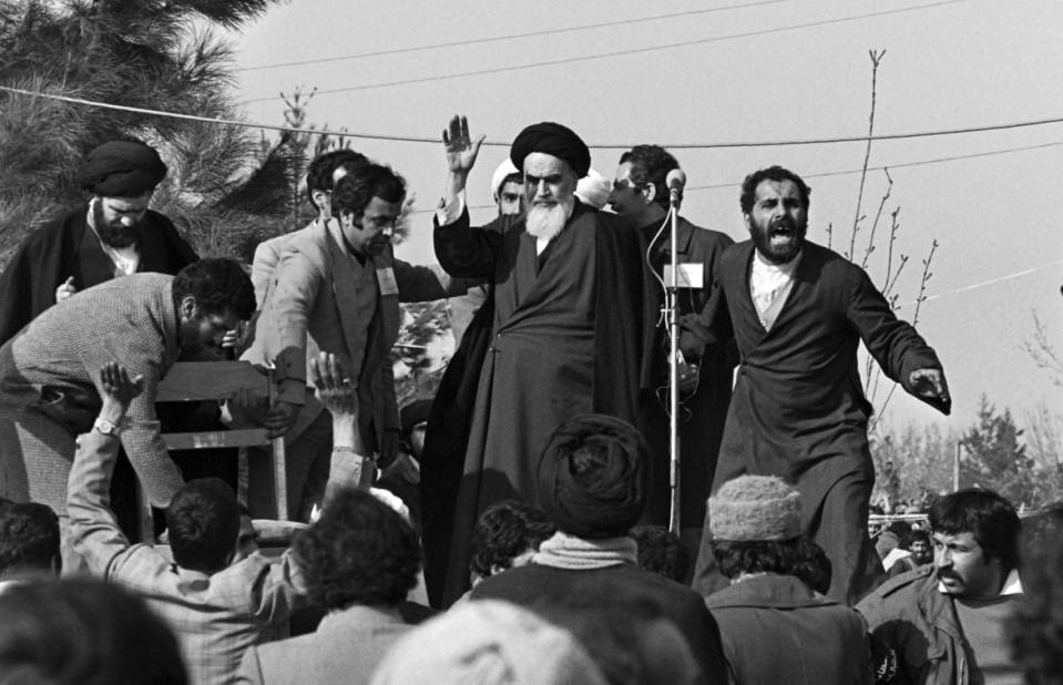 <div class="inline-image__caption"><p>Ayatollah Ruhollah Khomeini waves to a crowd of supporters gathered at the Behechte Zahra Cemetery in Tehran during his visit on the day of his return from France after 15 years of exile, as the insurrection against the Shah's regime spreads all over the country.</p></div> <div class="inline-image__credit">Gabriel Duval/Getty</div>