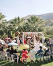 <p>Opt for color—in a different way. Skip the over-the-top flower installations or wedding arches and go for colorful streamers a la Samira Wiley and Lauren Morelli's ceremony in Palm Springs, CA. Inspired by confetti cake and all things fun, the pair kept their altar carefree, lively, and a reflection of their vibrant, zest for life as individuals, and a couple. </p><p><em>Pictured: Planning by <a href="https://www.bethhelmstetter.com/" rel="nofollow noopener" target="_blank" data-ylk="slk:Beth Helmstetter;elm:context_link;itc:0;sec:content-canvas" class="link ">Beth Helmstetter</a>; Florals by <a href="http://www.hollyflora.com/" rel="nofollow noopener" target="_blank" data-ylk="slk:Holly Flora;elm:context_link;itc:0;sec:content-canvas" class="link ">Holly Flora</a>. </em></p>