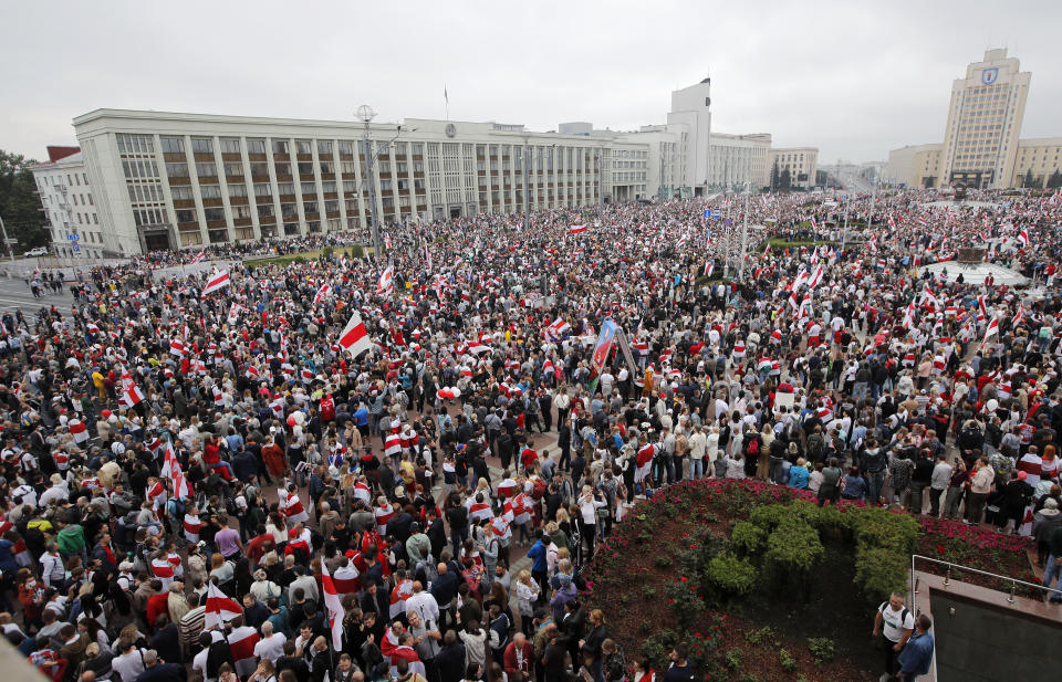 Thousands of people gather for a protest at the Independence square in Minsk, Belarus, Sunday, Aug. 23, 2020. Demonstrators are taking to the streets of the Belarusian capital and other cities, keeping up their push for the resignation of the nation's authoritarian leader. President Alexander Lukashenko has extended his 26-year rule in a vote the opposition saw as rigged. (AP Photo/Dmitri Lovetsky)