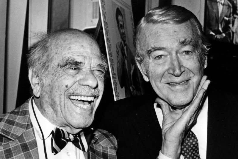 Oscar-winning film director Frank Capra (L) gives legendary film actor Jimmy Stewart a playful squeeze under the chin January 23, 1985. On September 3, 1991, Capra died at the age of 94. UPI File Photo