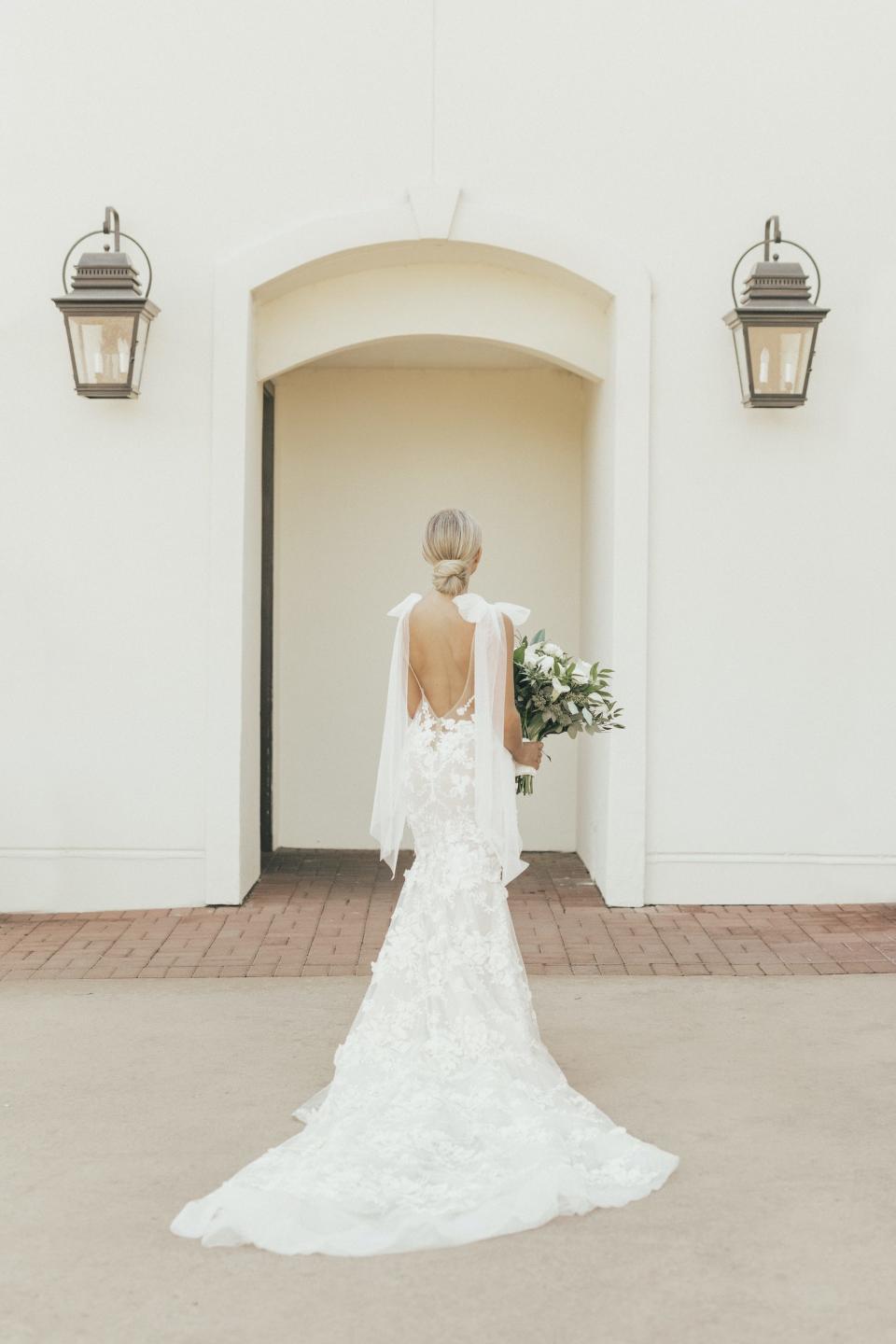 A bride turns away from the camera.