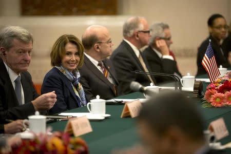 U.S. House Minority Leader Nancy Pelosi (2nd L) smiles during a bilateral meeting with Zhang Ping, Vice Chairman of China's National People's Congress, at the Great Hall of the People in Beijing, Thursday, Nov. 12, 2015. REUTERS/Mark Schiefelbein/Pool