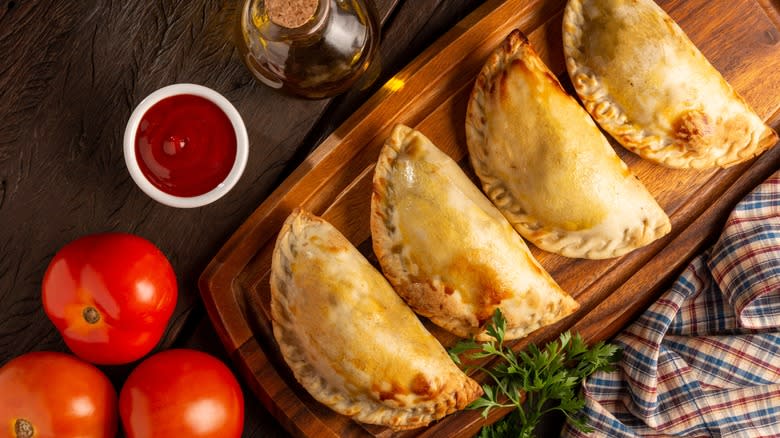 empanadas on wood board