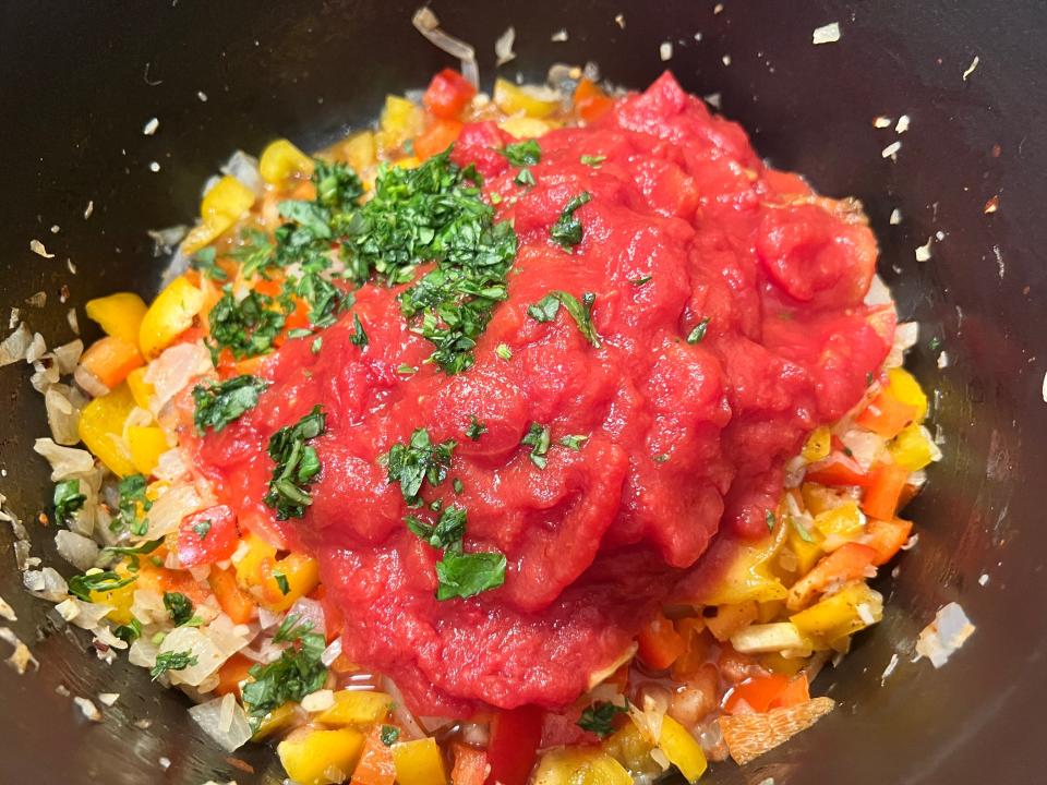 Bell peppers and tomato sauce in pot