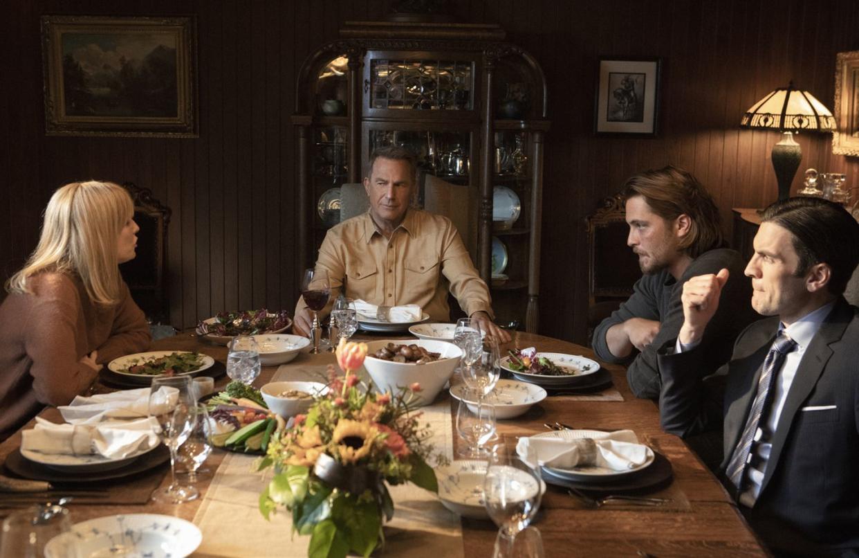 the dutton family from l to r   kelly reilly, kevin costner, luke grimes and wes bentley debate at the dinner  table in paramount network's hit drama series 