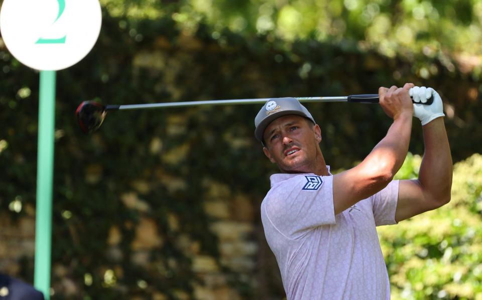 Bryson DeChambeau hits his tee shot on the second hole