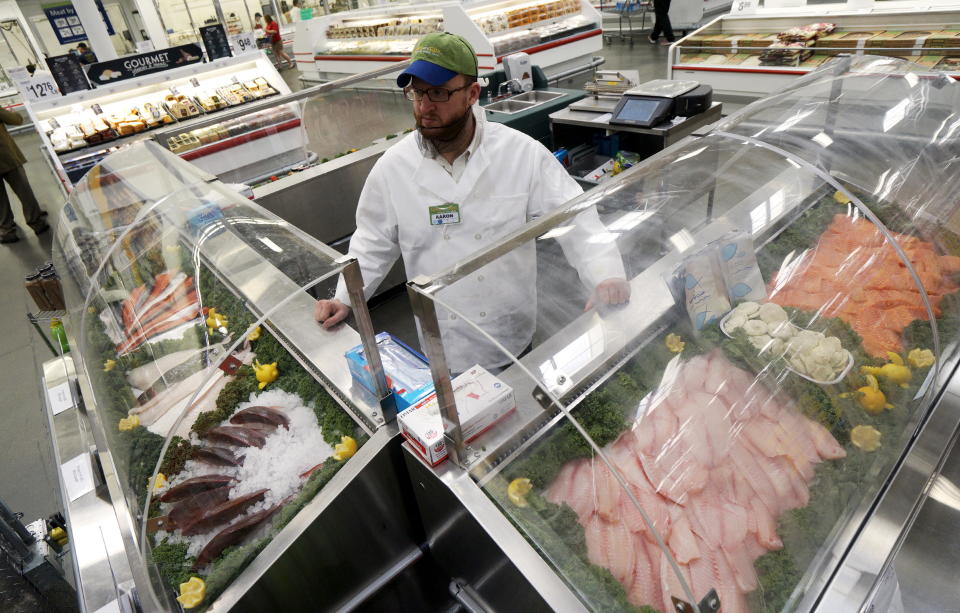 An employee waits for customers at the fresh fish counter at the Wal-Mart owned Sam's Club in Bentonville, Arkansas, June 4, 2015. Wal-Mart will hold its annual meeting June 5, 2015.  REUTERS/Rick Wilking