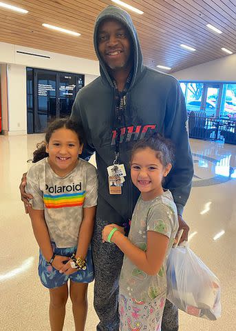 <p>Kevin Ford</p> Kevin Ford with his two granddaughters.