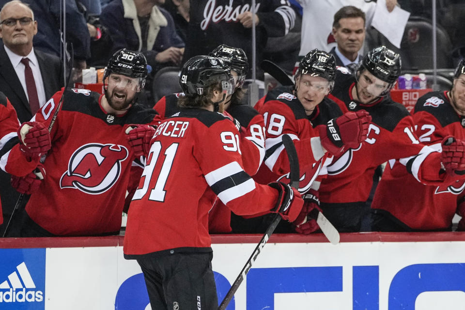 New Jersey Devils' Dawson Mercer (91) is congratulated for his goal against the New York Rangers during the second period of Game 5 of an NHL hockey Stanley Cup first-round playoff series Thursday, April 27, 2023, in Newark, N.J. (AP Photo/Frank Franklin II)
