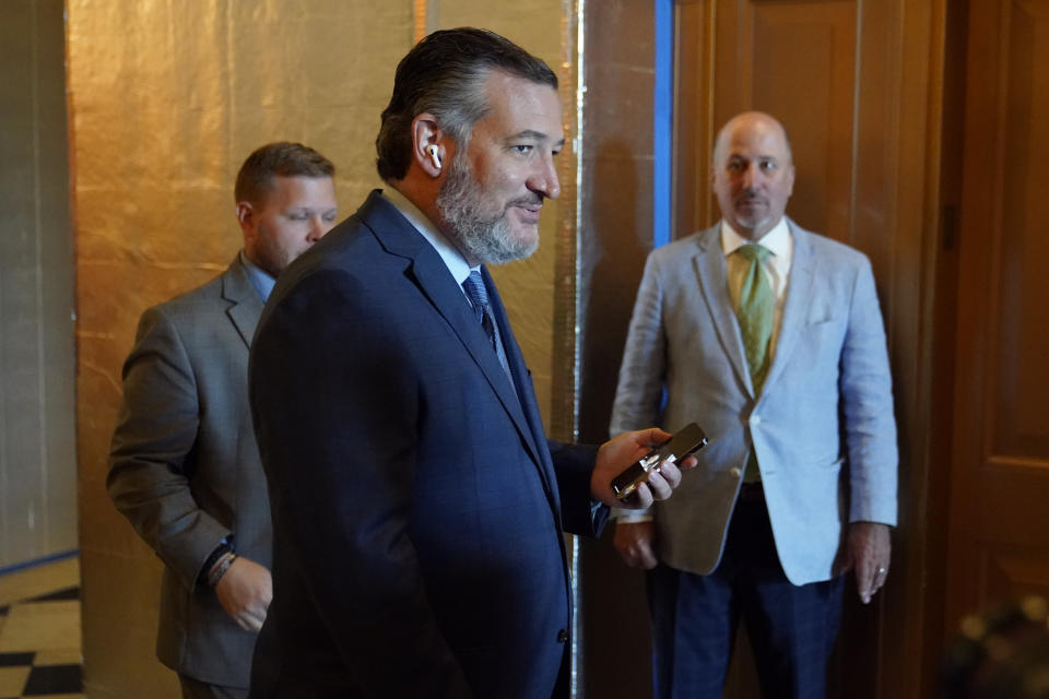 Sen. Ted Cruz, R-Texas, steps out of the Senate Chamber on Capitol Hill in Washington, Saturday, Aug. 6, 2022. (AP Photo/Patrick Semansky)