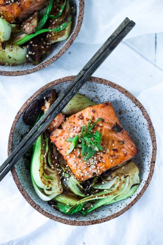 <p>A delicious, healthy recipe for teriyaki salmon with baby boy choy and shiitake mushrooms with only 15 minutes of hands on time before baking in the oven. Simple and easy.</p><p><strong>Get the recipe: <a href="https://www.feastingathome.com/sheet-pan-salmon-and-bok-choy/" rel="nofollow noopener" target="_blank" data-ylk="slk:Sheet Pan Teriyaki Salmon with Bok Choy and Shiitake;elm:context_link;itc:0;sec:content-canvas" class="link "><em>Sheet Pan Teriyaki Salmon with Bok Choy and Shiitake</em></a></strong></p>