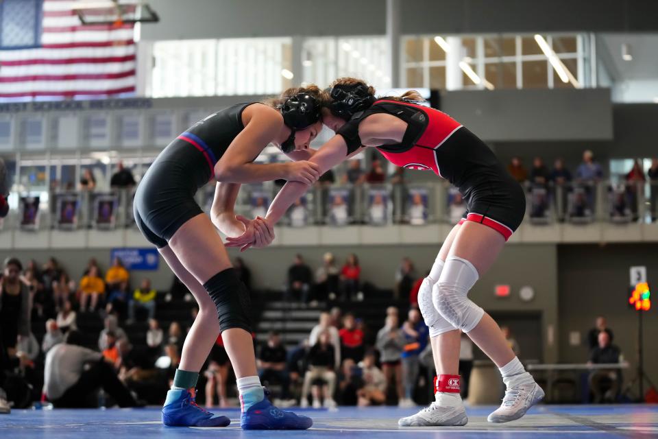 Raccoon River's Katie Biscoglia, left, wrestles Cedar Falls' Natalie Blake during the semifinal round at the Northwest Girls Invite on at Waukee Northwest High School on Saturday, Jan. 14, 2023. Biscoglia won, 14-0, and went on to finish first at 100 pounds.