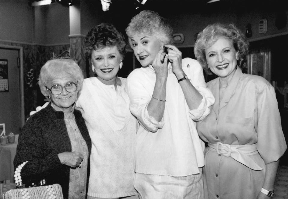 FILE - Actors from the television series "The " Golden Girls" stand together during a break in taping Dec. 25, 1985 in Hollywood. From left are, Estelle Getty, Rue McClanahan, Bea Arthur and Betty White. Betty White, whose saucy, up-for-anything charm made her a television mainstay for more than 60 years, has died. She was 99. (AP Photo/Nick Ut, File)