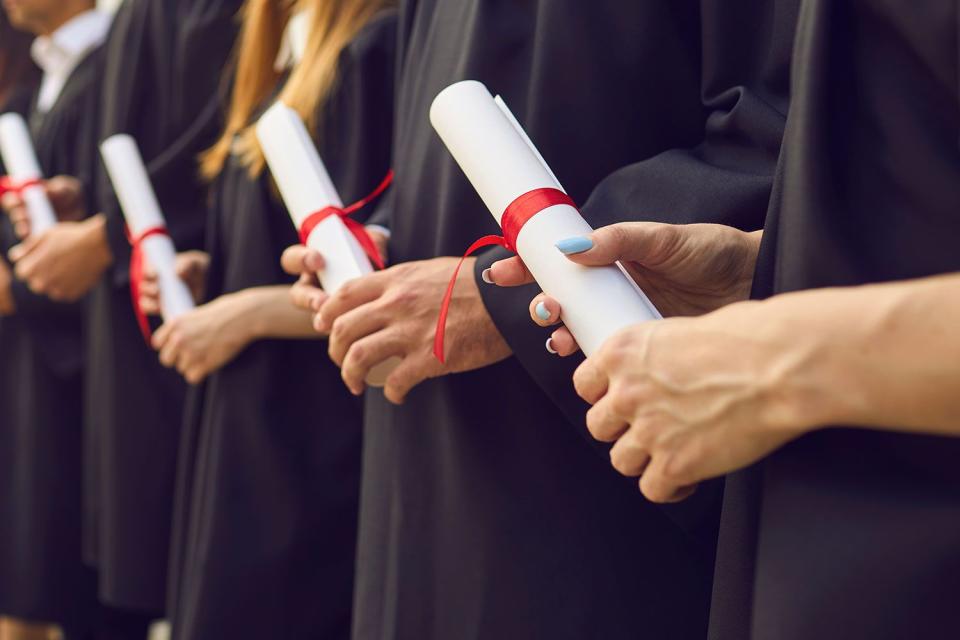 <p>getty</p> students with diplomas -- stock image