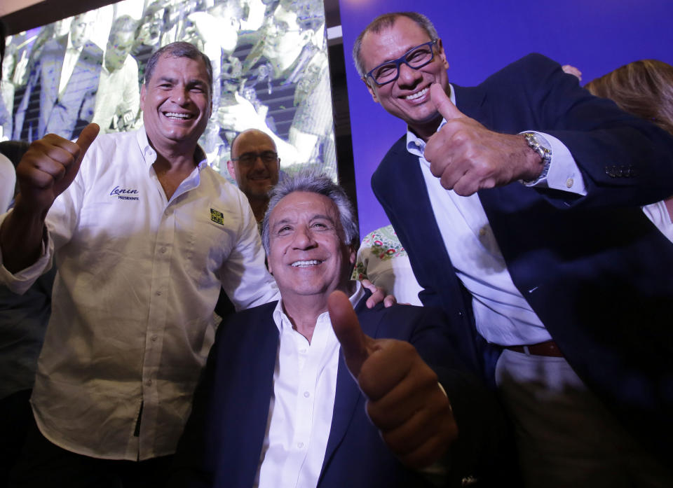 Ecuador's President Rafael Correa, from left, Lenin Moreno, presidential candidate for the ruling party Alliance PAIS, and running mate Vice President Jorge Glas, flash thumbs up as they celebrate the closing of the polls, in Quito, Ecuador, Sunday, Feb. 19, 2017. Ecuadoreans voted for a new leader in Sunday's general election, and exit polls indicated, Moreno, Correa's hand-picked successor was close to the threshold needed to win outright and avoid a runoff against his nearest rival. (AP Photo/Dolores Ochoa)