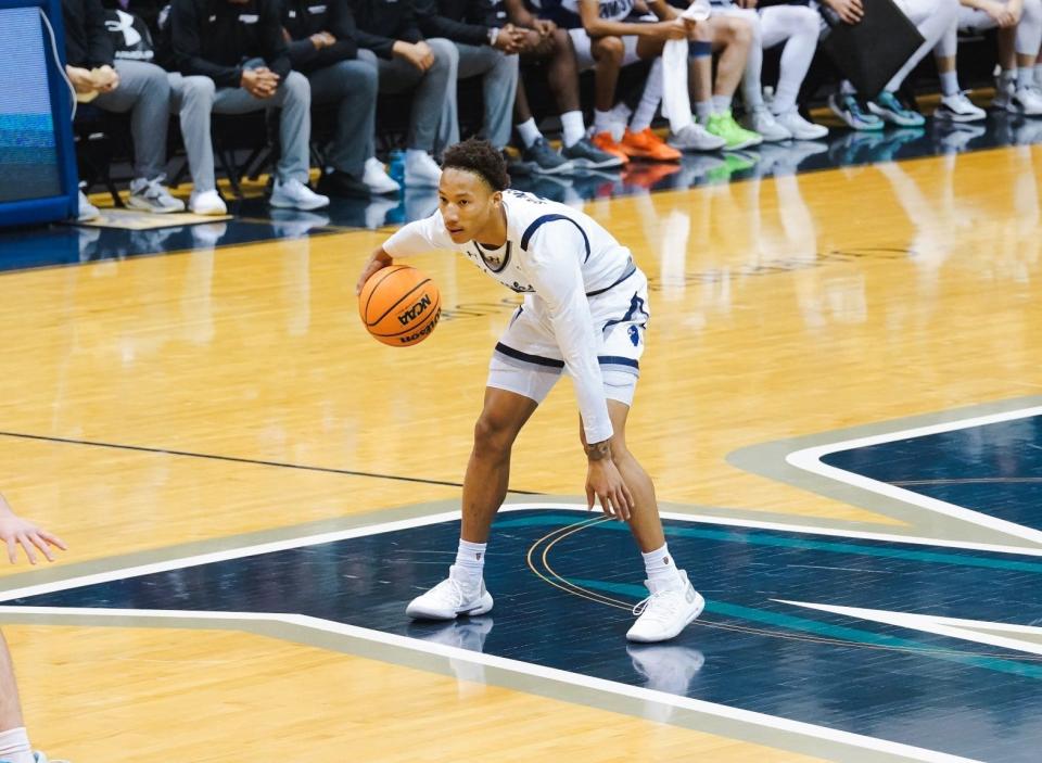 Monmouth guard Jakari Spence sets the offense up against Northwestern at OceanFirst Bank Center in West Long Branch on Jan. 8, 2024.