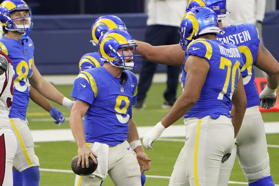 Los Angeles Rams quarterback John Wolford (9) reacts with teammates during the second half of an NFL football game against the Arizona Cardinals in Inglewood, Calif., Sunday, Jan. 3, 2021. (AP Photo/Jae C. Hong)