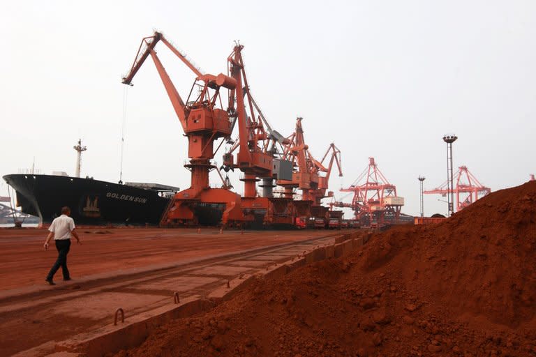 Soil containing various rare earth minerals is being loaded onto a ship at a port in Lianyungang, east China's Jiangsu province, on September 5, 2010. China has announced its closely watched export quota for rare earth minerals in the second half of this year, bringing the full-year total to 31,001 tonnes