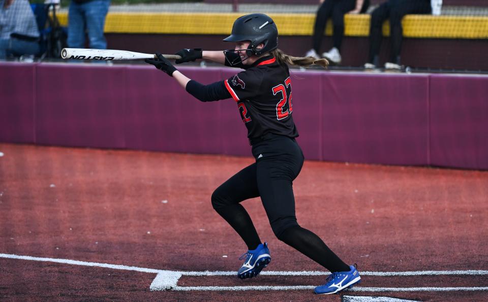 Edgewood’s Piper Stephens (22) puts the ball in play during the softball game at Bloomington North on Tuesday, March 26, 2024.