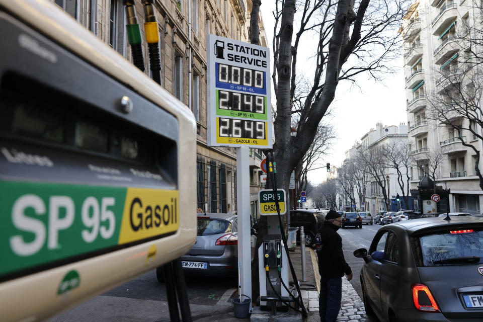 FILE - A car stops in a gas station where prices are up to 2,75 euros per liter (US dlrs. 3.04) in Marseille, southern France, Wednesday, March 9, 2022. Italian Prime Minister Mario Draghi's offer to resign has sent unsettling ripples through financial markets, bringing back bad memories of Europe's debt crisis a decade ago and complicating the European Central Bank's job as it raises interest rates for the first time in 11 years to combat record inflation. (AP Photo/Jean-Francois Badias, File)