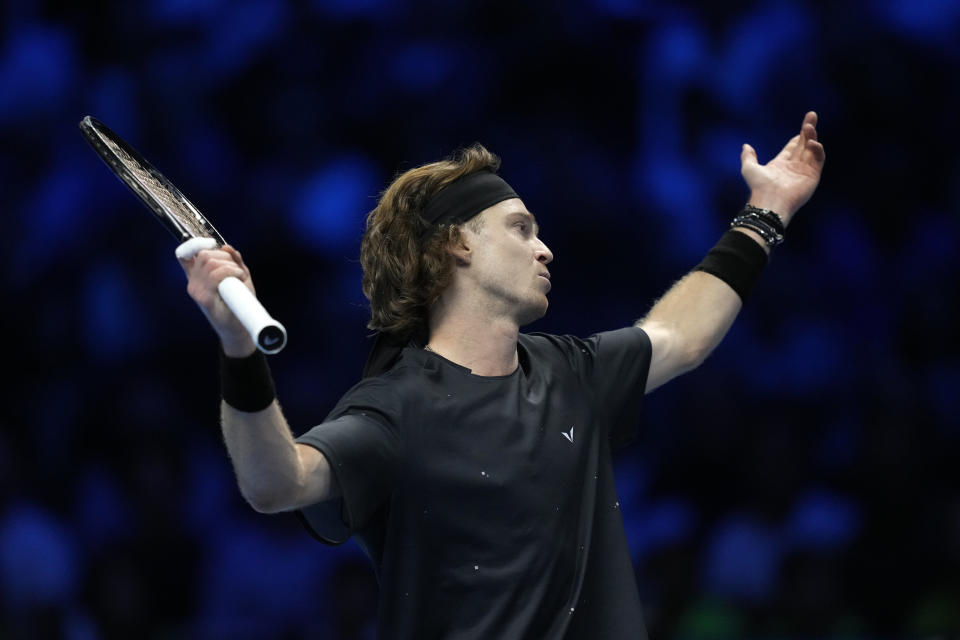 Russia's Andrej Rublev reacts during the singles tennis match against Spain's Carlos Alcaraz, of the ATP World Tour Finals at the Pala Alpitour, in Turin, Italy, Wednesday, Nov. 15, 2023. (AP Photo/Antonio Calanni)