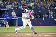 Toronto Blue Jays' Vladimir Guerrero Jr. hits a solo home run against the Cleveland Guardians during the sixth inning of a baseball game Friday, Aug. 25, 2023, in Toronto. (Christopher Katsarov/The Canadian Press via AP)