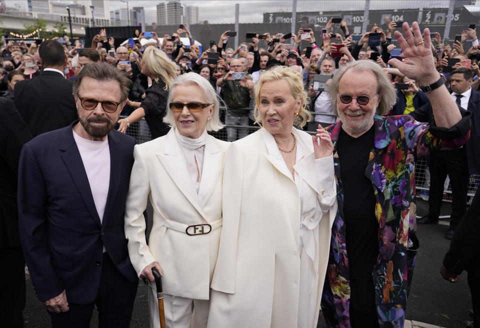 Members of ABBA, from left, Bjorn Ulvaeus, Anni-Frid Lyngstad, Agnetha Faltskog and Benny Andersson arrive for the ABBA Voyage concert at the ABBA Arena in London, Thursday May 26, 2022. ABBA is releasing its first new music in four decades, along with a concert performance that will see the "Dancing Queen" quartet going entirely digital. The virtual version of the band will begin a series of concerts on Thursday. (AP Photo/Alberto Pezzali)