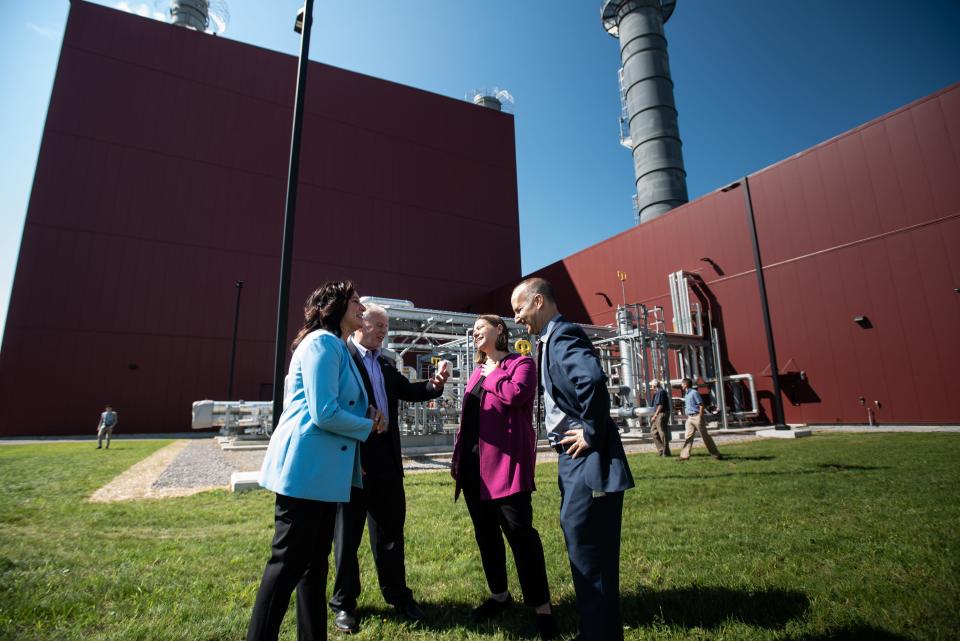 From left. Rep. Angela Witwer (D-MI-071), Board of Water & Light  (BWL) General Manager Dick Peffley, U.S. Rep. Elissa Slotkin, (MI-08), and Lansing Mayor Andy Schor chat Tuesday, Aug. 23, 2022, during the public unveiling of BWL's Delta Energy Park located at the Erickson Power Station in Delta Township.