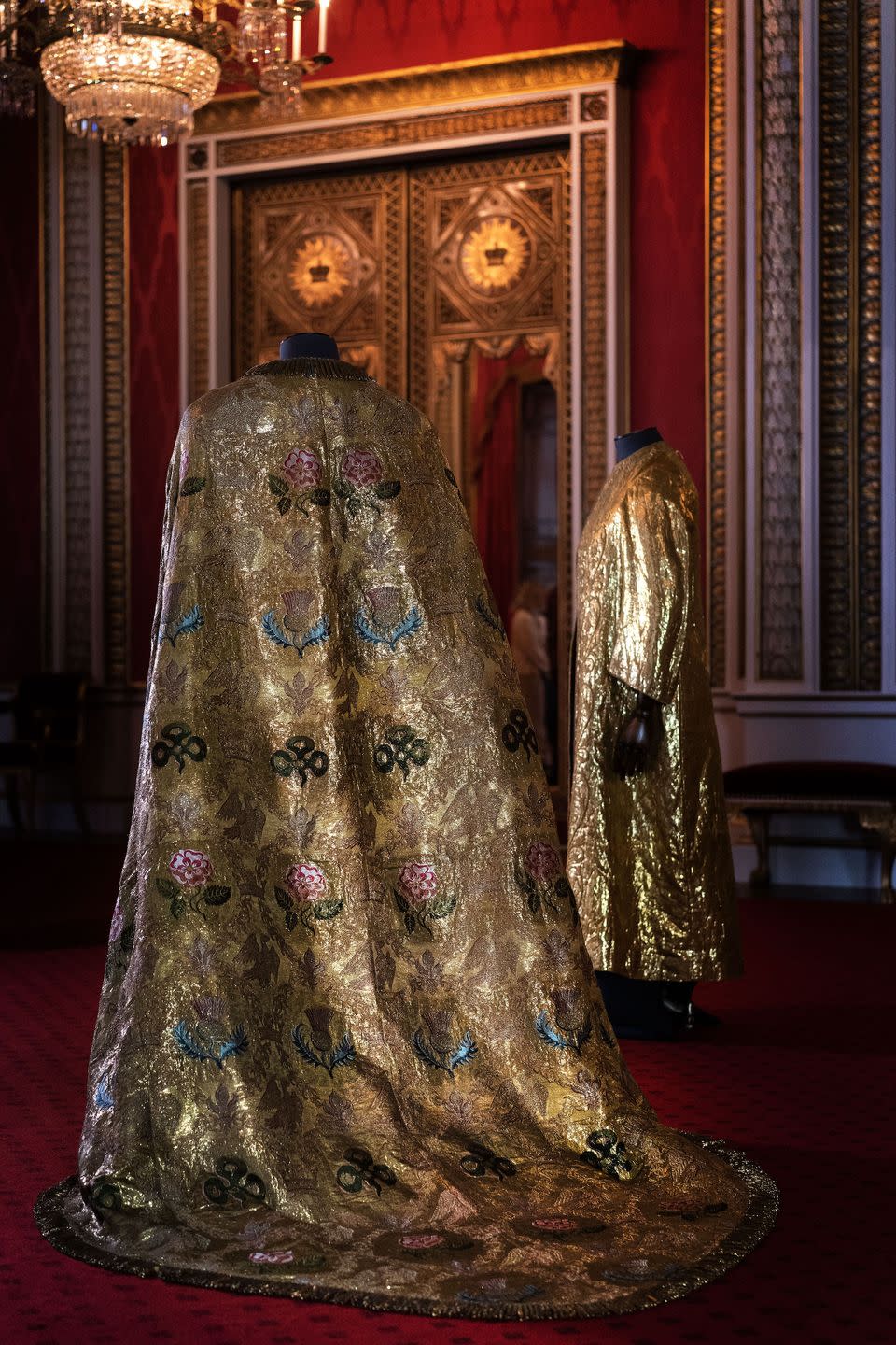 london, england may 01 the coronation vestments, comprising of the imperial mantle left and the supertunica right, displayed in the throne room at buckingham palace on may 1, 2023 in london, england the vestments will be worn by king charles iii during his coronation at westminster abbey on may 6 photo by victoria jones poolgetty images