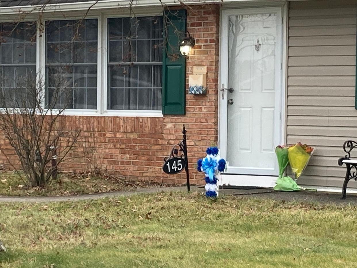 Neighbors and strangers have left flowers at the front door of the Mohn residence in the Upper Orchard section of Levittown on Thursday Feb. 1, 2024.