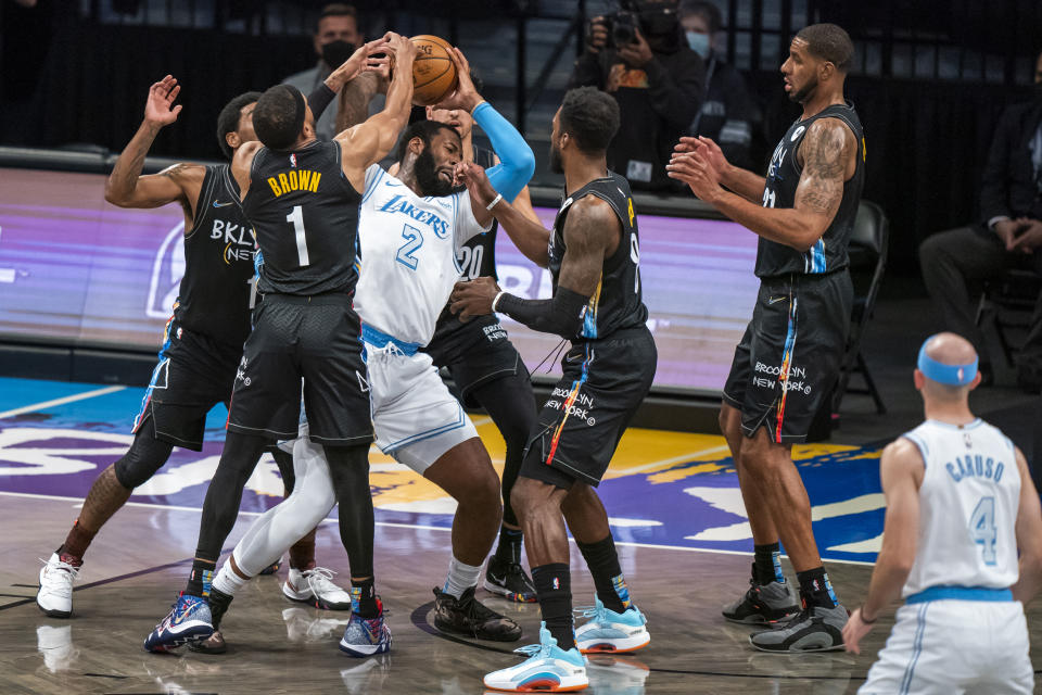 Los Angeles Lakers center Andre Drummond (2) is defended by several Brooklyn Nets during the first half of an NBA basketball game, Saturday, April 10, 2021, in New York (AP Photo/Corey Sipkin).