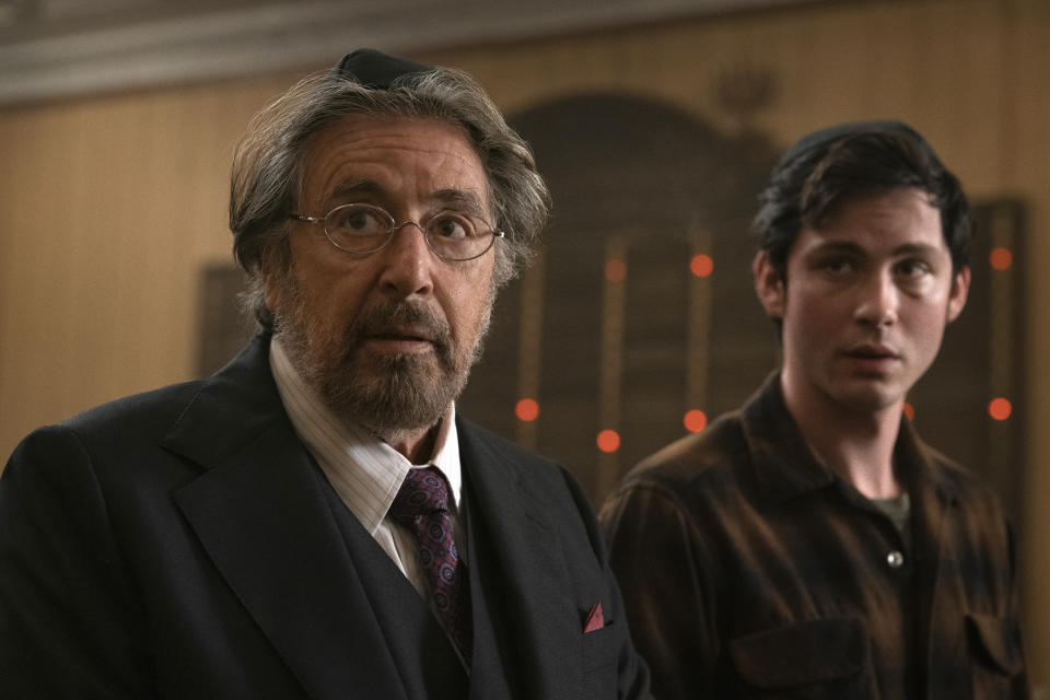 This image released by Amazon Studios shows Al Pacino, left, and Logan Lerman in a scene from "Hunters." In Amazon’s “Hunters,” an unlikely group of 1970s New Yorkers target German Nazis who have brought their genocidal quest to America. (Christopher Saunders/Amazon Studios via AP)