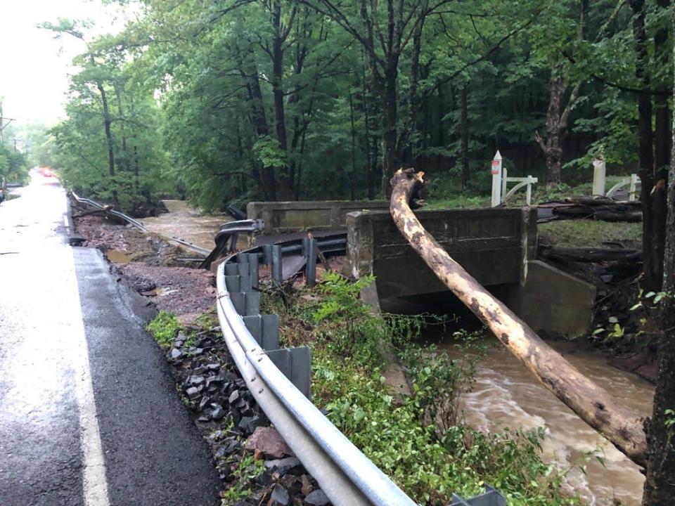 Flash floods damaged, even washed away, roads in Upper Makefield during heavy downpours on July 15, 2023.   At least three people were confirmed dead in the floodings and dozens were forced to abandoned their vehicles.