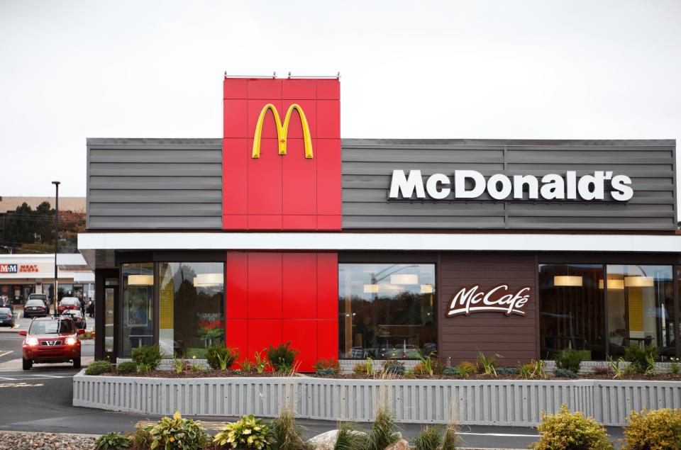 Exterior of newly re-designed McDonalds location with a car waiting in the Drive Through lane on Lacewood Drive in Halifax. McDonalds has recently begun renovating many of their locations to a new, more modern look featuring the McCafe branding.