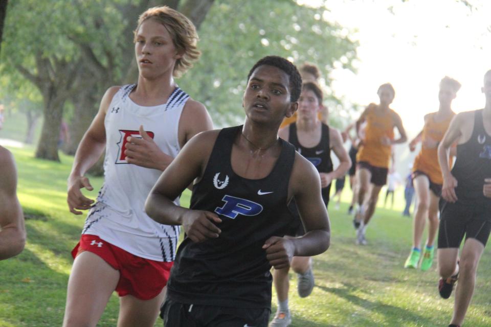 A Ballard runner competes during the Tiger Invitational on Monday, Sept. 18, 2023, at Hillcrest Country Club in Adel.