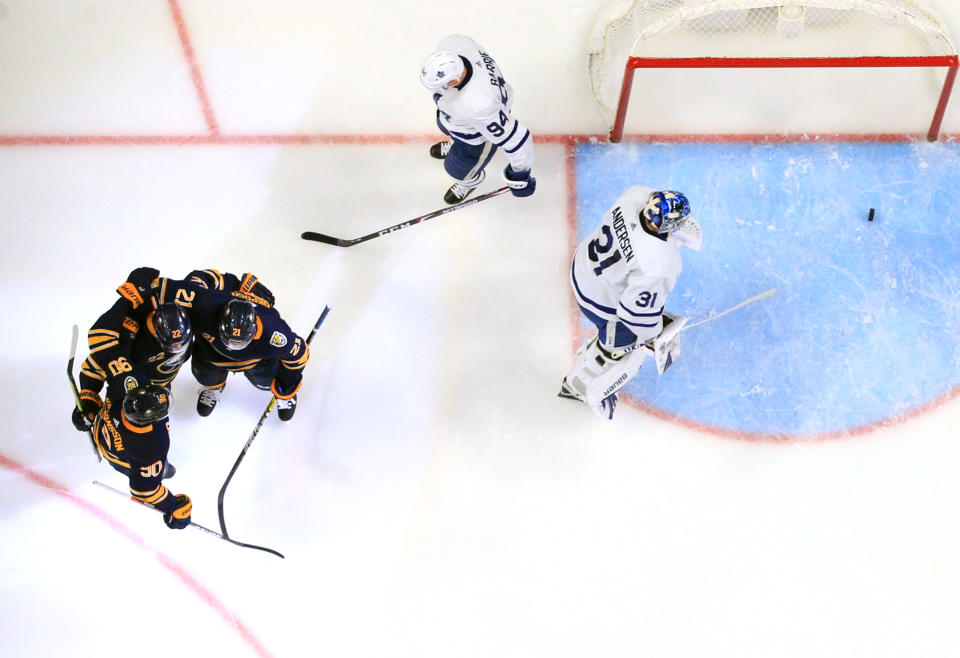 BUFFALO, NY - FEBRUARY 16: Johan Larsson #22 of the Buffalo Sabres celebrates his goal with teammates during an NHL game against the Toronto Maple Leafs on February 16, 2020 at KeyBank Center in Buffalo, New York. (Photo by Bill Wippert/NHLI via Getty Images)