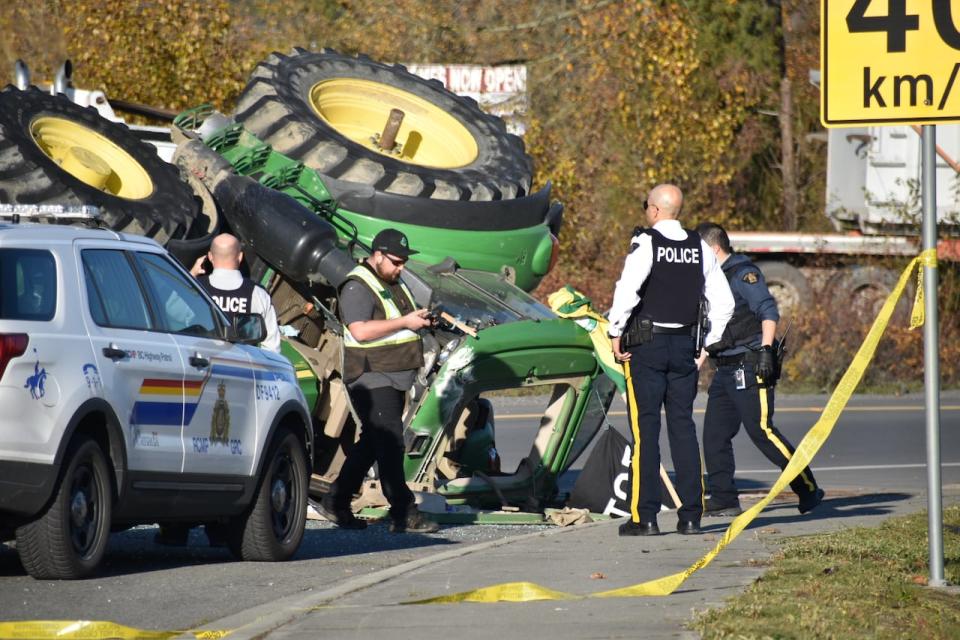 RCMP say a tractor rolled over after colliding with a police vehicle in Surrey, B.C., on Nov. 25, 2023. (Curtis Kreklau - image credit)