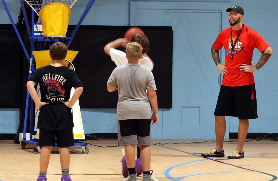 Kris Lang watches his students shoot free throws Thursday morning, Aug. 4, 2022, at Kris Lang Sports Complex on East Catawba Street in Belmont.