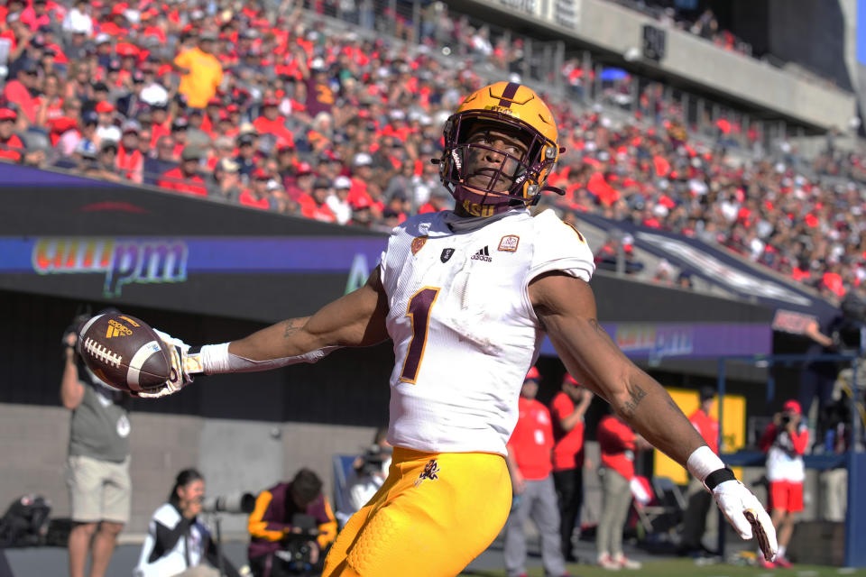 Arizona State running back Xazavian Valladay reacts after scoring atouchdown against Arizona in the first half of an NCAA college football game, Friday, Nov. 25, 2022, in Tucson, Ariz. (AP Photo/Rick Scuteri)