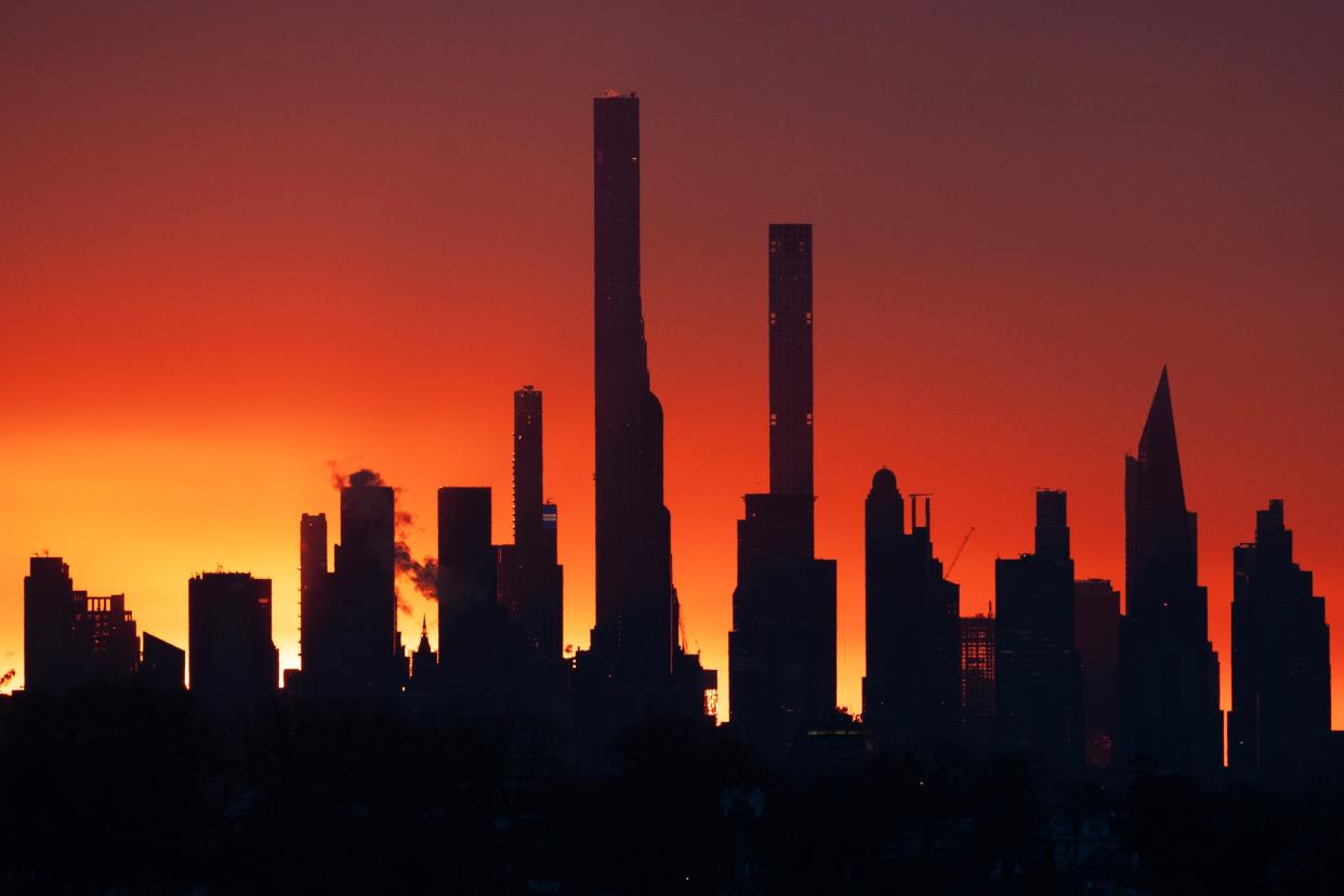 Sunrise through the New York City skyline, seen from Clifton, NJ on Thursday Jan. 18, 2024.