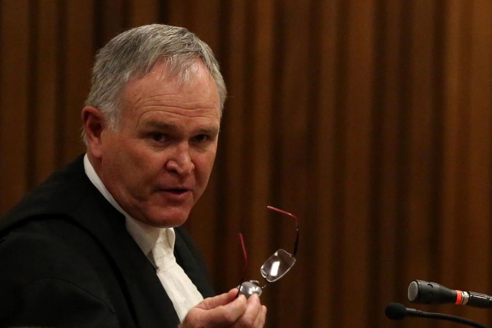 Defense lawyer Barry Roux, reacts to questions by state prosecutor, during cross-examination of Oscar Pistorius, in court in Pretoria, South Africa, Wednesday, April 9, 2014. Pistorius is charged with the murder of his girlfriend Reeva Steenkamp, on Valentines Day in 2013. (AP Photo/Siphiwe Sibeko, Pool)