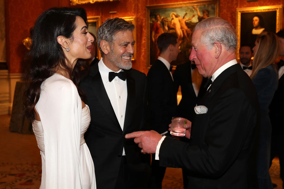 Amal and George meeting Prince Charles at the Buckingham Palace dinner last week [Photo: Getty]