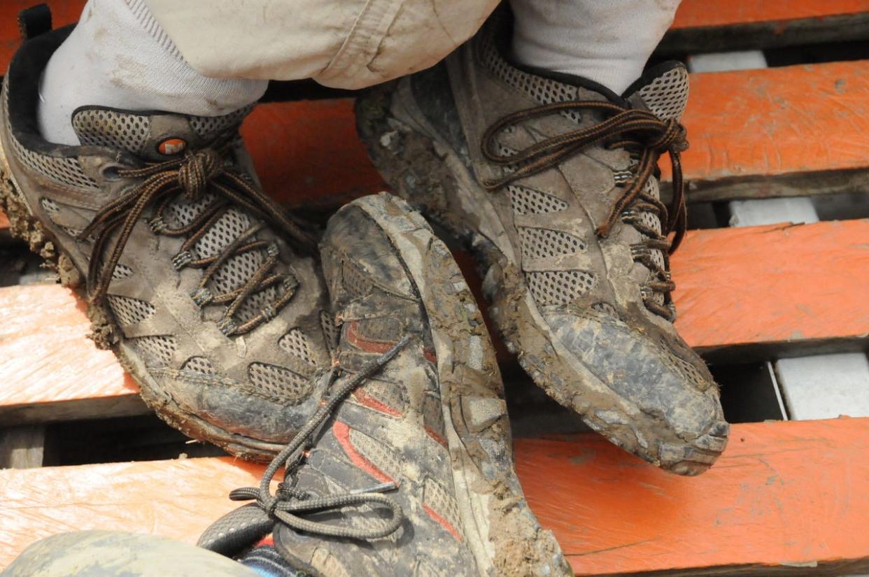 His and her muddy shoes