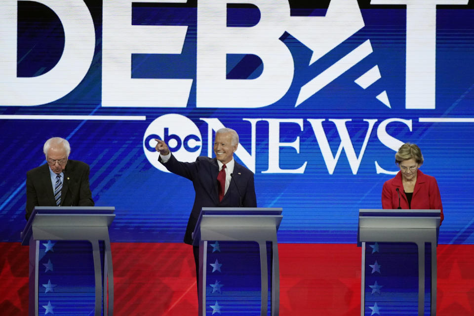 From left, presidential candidates Sen. Bernie Sanders, I-Vt, former Vice President Joe Biden and Sen. Elizabeth Warren, D-Mass. take their places Thursday, Sept. 12, 2019, before a Democratic presidential primary debate hosted by ABC at Texas Southern University in Houston. (AP Photo/David J. Phillip)