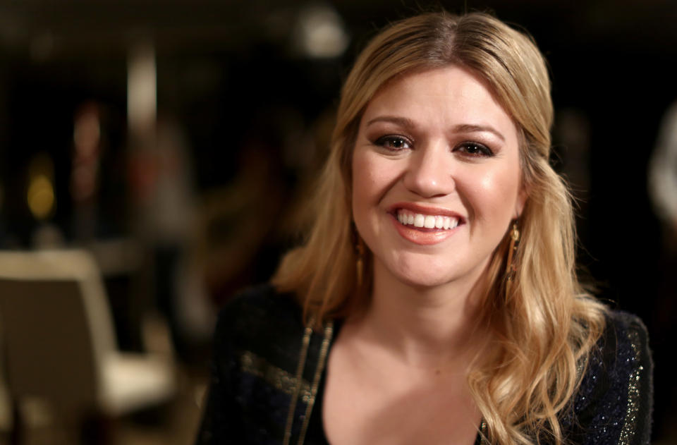 In this Monday, Nov. 5, 2012 photo, musician Kelly Clarkson poses for a portrait in Los Angeles. Clarkson's newest album, "Greatest Hits: Chapter One," is releasing on Monday, Nov. 19, 2012. (Photo by Matt Sayles/Invision/AP)
