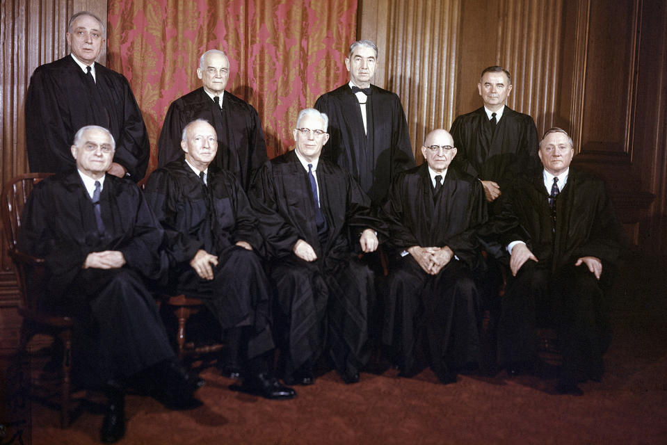 FILE - Justices of the Supreme Court of the United States of America are shown in their judicial robes in Washington, on Jan. 29, 1957. Seated from left are, Felix Frankfurter, Hugo Black, Earl Warren, Stanley Reed and William O. Douglas. Standing from left are, John M. Harlan; Harold Burton; Tom Clark; and William J. Brennan. Supreme Court justices have long prized confidentiality. It’s one of the reasons the leak of a draft opinion in a major abortion case last week was so shocking. But it’s not just the justices’ work on opinions that they understandably like to keep under wraps. The justices are also ultimately the gatekeepers to information about their travel, speaking engagements and health issues. (AP Photo)